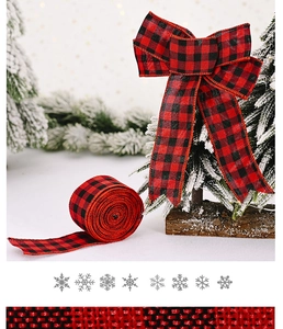 Macro detail of red and black buffalo plaid Christmas ribbon tied in a decorative bow