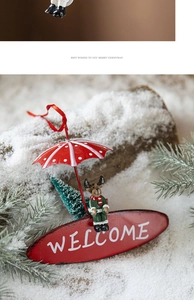Christmas welcome sign featuring a red reindeer with an umbrella and a miniature pine tree