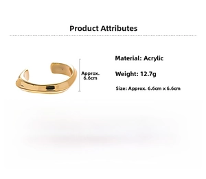 Detail view of irregular gold acrylic wave bangle with weight and size specifications
