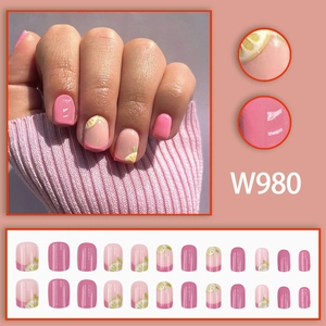 Pink press-on nail kit featuring sweet lemon patterns and 24 assorted sizes