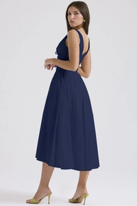 Detailed back view of navy blue V-neck midi dress showing A-line silhouette and slim waist