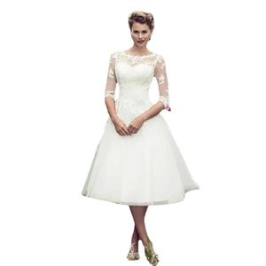 Elegant white lace wedding dress with illusion neckline and sheer 3/4 sleeves in A-line