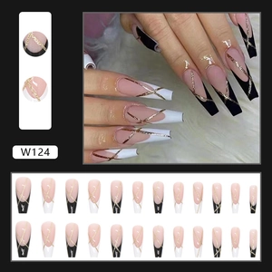 Press-on nails with nude pink base, black and white French tips and gold glitter lines