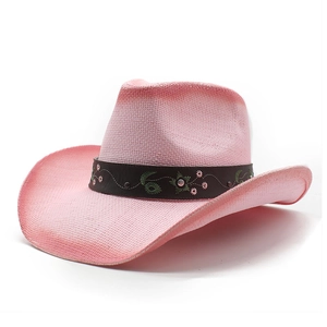 Detailed close-up of pink gradient straw cowboy hat with floral vine embroidery and metal studs