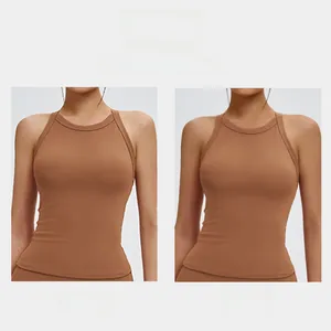 Detail showing the narrowed underarm side cut for improved fit on brown yoga sports vest