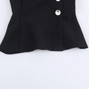 Black crop top with decorative rhinestone buttons and premium fabric texture detail