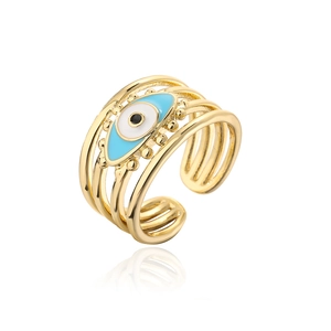 Detail of layered gold evil eye ring with blue enamel and adjustable open band