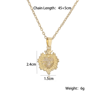 Detail view of gold Sacred Heart pendant with dimensions 2.4cm by 1.5cm and chain length