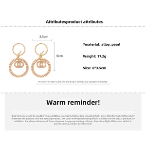 Detailed dimensions of gold interlocking hoop earrings with small pearl accents