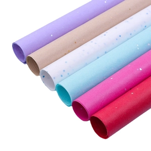 Rolls of colorful glitter floral wrapping paper in six vibrant shades on a clean white background