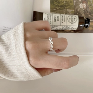 Minimalist 925 sterling silver beaded open ring with zircon shown in a lifestyle setting