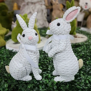 Pair of Easter resin bunnies with rattan texture effect and white ribbon bows