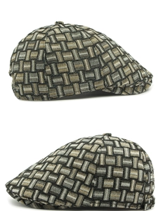 Detail showing jacquard texture and side buckle on the retro plaid flat cap