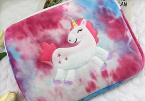 Detail of plush tie-dye sleeve with unicorn embroidery and white zipper closure