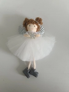 Detail of Christmas angel ornament with brown hair, silver wings and white mesh skirt