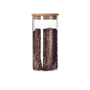 Airtight glass food storage jar with bamboo lid for coffee beans on white background