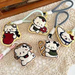 Detailed view of five embroidered 3D cartoon cat charms with colorful hanging ropes