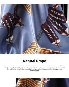 Detailed view of blue satin scarf with vintage belt and gold chain print texture