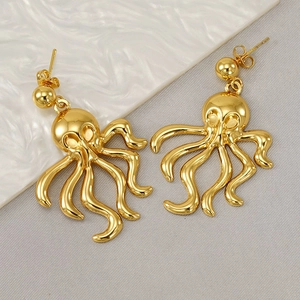 Detailed macro view of 18K gold-plated octopus earrings with polished metal finish