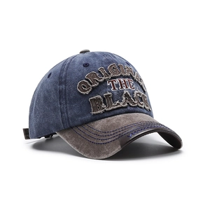 Vintage washed cotton baseball cap with blue crown and brown brim and embroidery