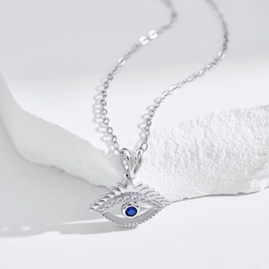 Detailed close-up of S925 sterling silver evil eye pendant with blue and white zircons