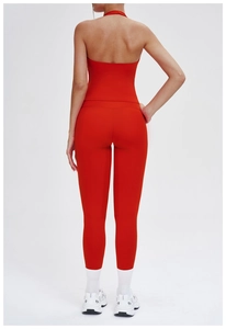 Back view of a red yoga set featuring a halter backless top and high waist leggings