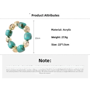 Detailed view of acrylic beaded bracelet with green marble texture and golden irregular beads
