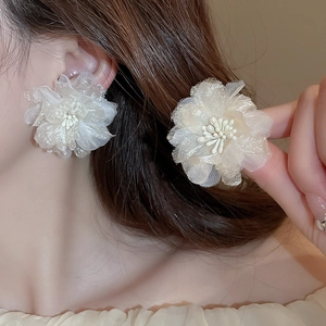 Elegant beige handmade woven lace flower earrings featuring delicate mesh fabric texture