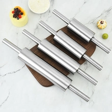 Set of four professional stainless steel rolling pins on a marble surface for baking