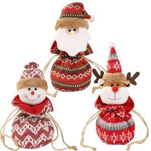 Three Christmas knitted drawstring gift bags featuring Santa, snowman, and reindeer shapes