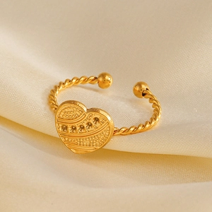 18K gold plated heart ring with twisted band on silk background, minimalist style