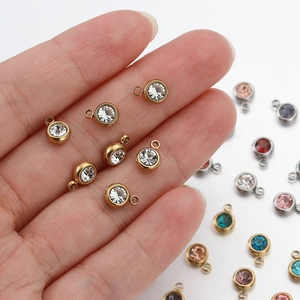 Colorful round rhinestone pendants in gold and silver stainless steel frames for DIY jewelry