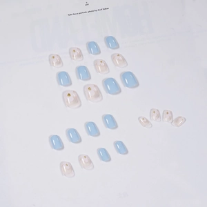 Light blue press-on nails set with 24 pieces featuring white floral and gold glitter accents