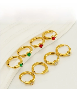 Detail of 18K gold plated hoop earrings featuring colorful zircon stones in claw settings