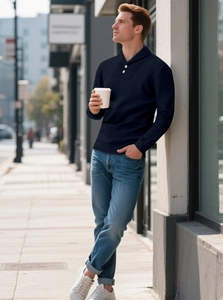 Detail view of navy waffle knit long sleeve polo shirt with textured fabric and collar