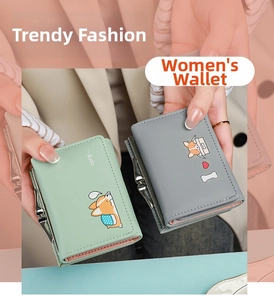 Detail of mint green and gray tri-fold wallets with cute corgi prints and metal clasp closures