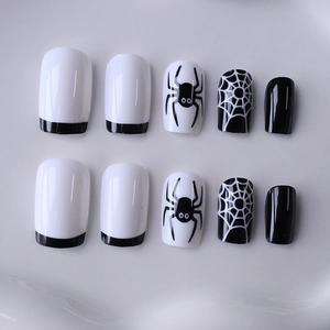 Halloween press-on nails with black spider and web designs in medium square shape