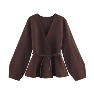 Women's dark brown V-neck peplum knit top with long sleeves and matching leather belt
