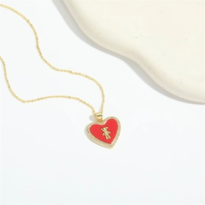 Classic French vintage gold heart necklace with red core and small bear pendant charm