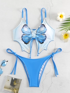 Detailed flat lay of butterfly wing bikini set with blue floral prints and side tie bottoms