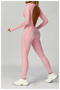 Detail of light pink yoga jumpsuit featuring back cutout and high-elastic athletic fabric