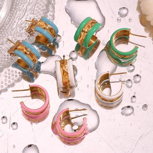 Artistic detail of C-shaped 18K gold plated earrings with colorful enamel and water drops