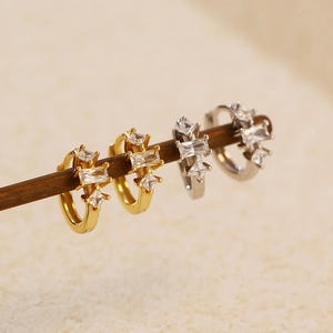 Detail view of gold and silver S925 sterling silver geometric zircon hoop earrings