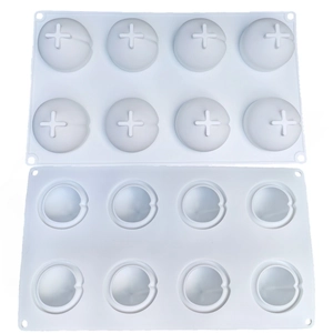 Macro detail of white silicone banana mousse cake molds with 8 spherical cavities