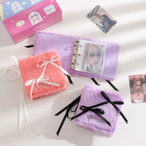 Macro detail of the plush fabric texture and elegant ribbon bow on the pink photo card album