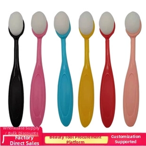 Detailed view of colorful makeup brush set with white fiber bristles and ergonomic handles