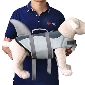 Close-up of shark fin dog life jacket with adjustable straps and secure grab handle