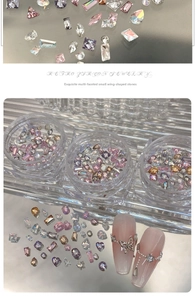 Detailed view of assorted crystal zircon nail charms in various shapes and colors