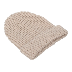Detailed view of beige waffle knit texture and foldable cuff on the warm winter hat