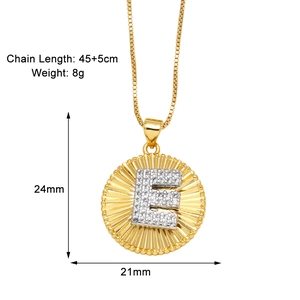 Detail view of 18k gold plated sunburst necklace with crystal letter E and dimensions